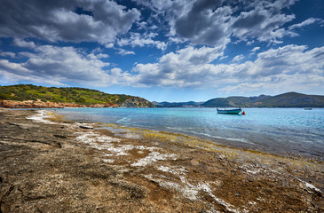 Incredibly romantic sunrise on Nuevo Loca Beach. Traveling concept background. Palaia Fokaia location in the morning light. Greece, Europe. Sunny morning seascape. Spring on the Greek coast Aegean sea