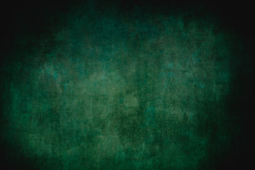 Dark green grungy backdrop or texture