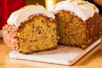 Homemade fruit cake with citrus candied fruits and nuts. Traditional easter cake with meringue inside