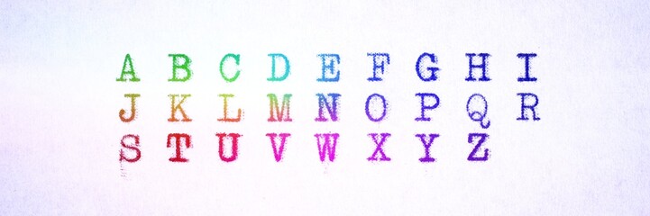 Panoramic image. Alphabet written with an old typewriter in many colors