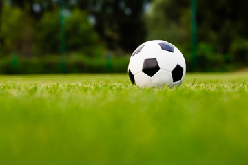 Obraz premium Soccer ball on the grass before the game