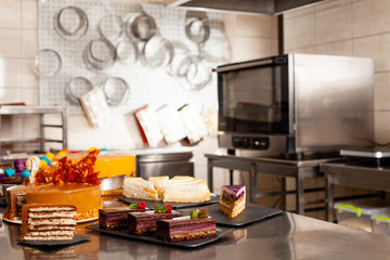 Fototapeta na wymiar Sweet pastries on a steel surface at professional kitchen