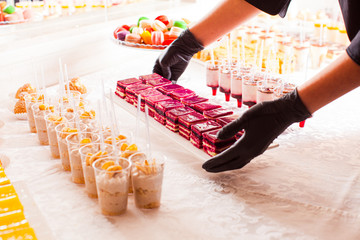 Buffet table with cakes and desserts. Wedding party.