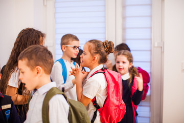 Group of school kids have a break time at school