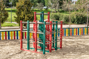 Fototapeta na wymiar wooden climbing frame in a playground in a park in Madrid. Spain.