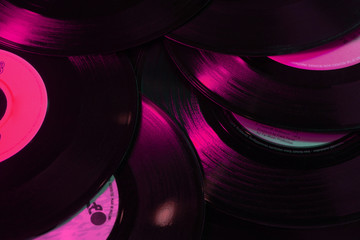 Vinyl records music background, texture, 80's, vintage, retro, acoustic, eighties, disco, gradient colours, close-up, party