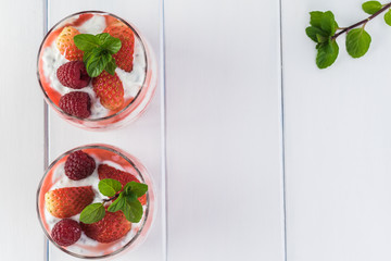 Chia pudding with strawberry sauce and berries.