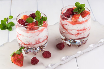 Chia pudding with strawberry sauce and berries.