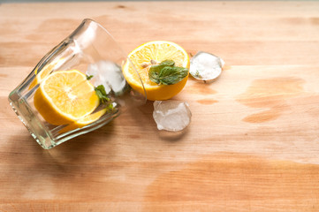 lemon with mint and ice in a glass