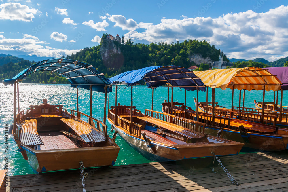 Wall mural touristic boats on a bled lake.