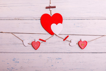 Red heart on white painted rustic wooden background soft focus. Best concept of Valentines Day with copy space.
