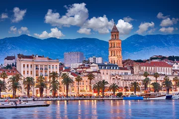 Fotobehang Split, Croatia. View of Split - the second largest city of Croatia at night. Shore of the Adriatic Sea and famous Palace of the Emperor Diocletian. Traveling concept. Mediterranean countries. © zicksvift