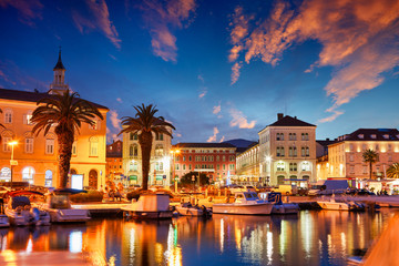 Split, Croatia. View of Split - the second largest city of Croatia at night. Shore of the Adriatic Sea and famous Palace of the Emperor Diocletian. Traveling concept. Mediterranean countries.