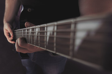the guy plays the electric guitar