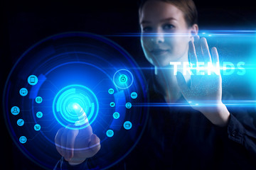 Business, Technology, Internet and network concept. Young businessman working on a virtual screen of the future and sees the inscription: Trends