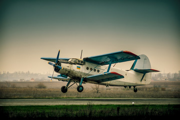 plane on the runway at sunset