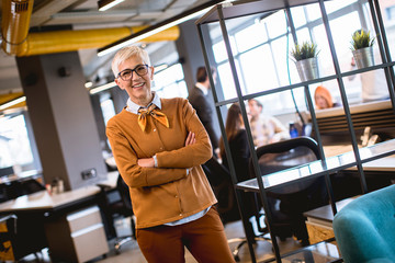 Senior businesswoman standing in office