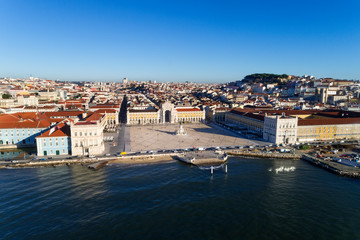 Fototapeta na wymiar Aerial view of the skyline of the city of Lisbon with the Comercio Square, the Alfama Neighbourhood and the Tagus River, in Portugal