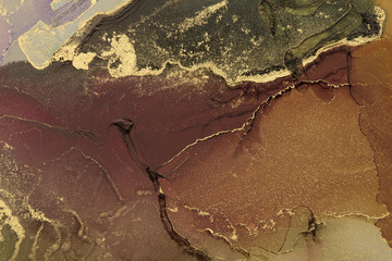 Abstract paint gold and brown blots background. Alcohol ink colors. Marble texture.