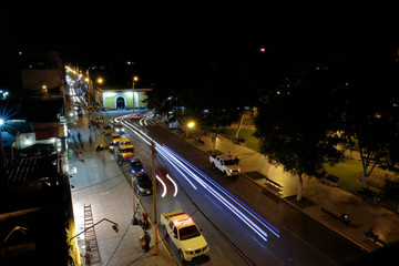 Particular scene on one side of the main square of Ica during the night. Ica-Peru