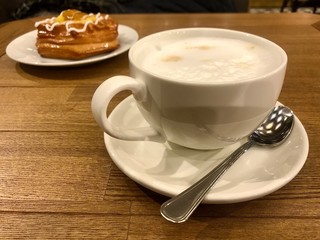 cappuccino Cup on a large wooden table