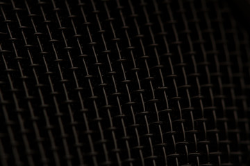 closeup macro of microphone dark black texture