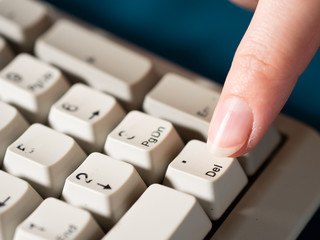 Female forefinger pushes POINT NUMPAD button. Close-up