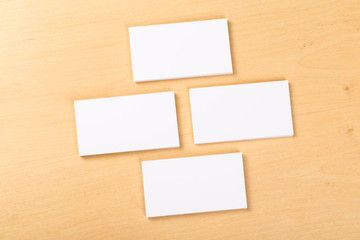 Photo of blank business cards on a general background. Template for identifier. View from above. mock up