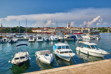 Fototapeta na wymiar Krk is a Croatian island in the northern Adriatic Sea, located near Rijeka in the Bay of Kvarner and part of Primorje Gorski Kotar county. Famous touristic Krk town, Croatia, Europe. Yachts and boats.