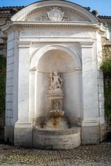  The angel ,Large ornate  stone fountain  , Dei gratia inter alia lucet ( Traslation , by the grace of god  she shines for us all  )°perne les fontaines provence south of France.