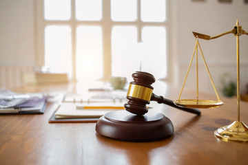 Justice law Scales and books and wooden gavel tool on desk in  Lawyer office.concept