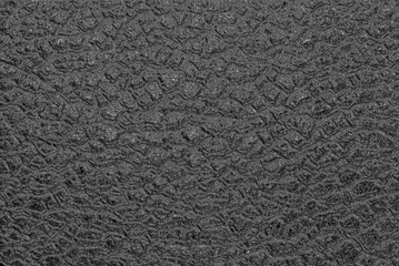 Artificial testure resembling wet asphalt with a rough surface.