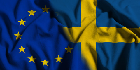 National flag of Sweden with European Union (EU) flag on a waving cotton texture background
