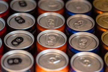 Close up shot of softdrink cans in a row