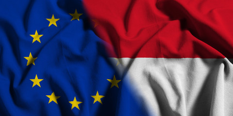 National flag of Indonesia with European Union (EU) flag on a waving cotton texture background