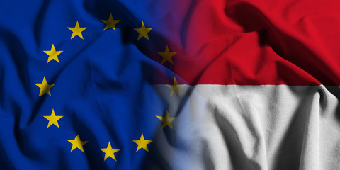 National flag of Indonesia with European Union (EU) flag on a waving cotton texture background