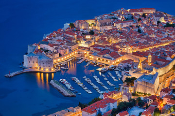Aerial view at famous european travel destination in Croatia, Dubrovnik old town, Dalmatia, Europe. UNESCO list. Medieval fortresses, Lovrijenac & Bokar after sunset in beautiful evening twilight.