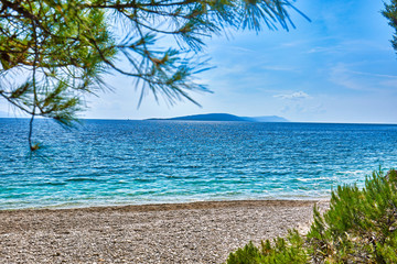 Fototapeta na wymiar Amazing seascape of Adriatic sea. Luchica beach Croatia, Europe. Colorful summer view of small beach. Croatian coast with clear water and pine trees around. Tropical viewpoint for design postcard.