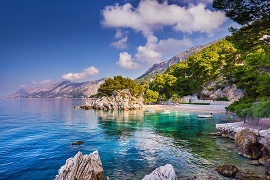 Brela stone, symbol of recreation area in Dalmatia, Croatia, Makarska riviera, Europe, famous tourist destination on Adriatic coast, sunny evening view. Beauty of nature concept background.
