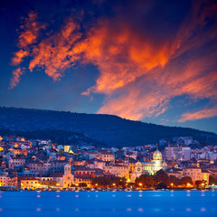 Large panorama of Unesco heritage historic town of Sibenik on Adriatic sea, Dalmatia, Croatia. Shot from the sea, harbor, waterfront and cathedral in front. Dramatic red sky at night..