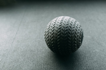 For warm-up and training. Black ball for exercise in the gym.