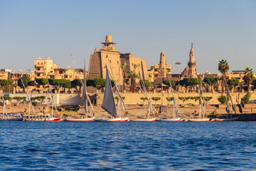 Luxor Temple is a large Ancient Egyptian temple complex on east bank of Nile river in Luxor (ancient Thebes). View from Nile river © olyasolod