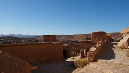 Bright landscape of Morocco, breathtaking curves of mountains, stunning combination of hills & farm land,inadvertent distribution of houses & huts, raw impression of pure nature.