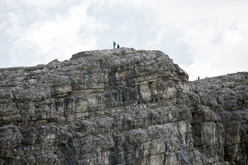 Hike the mountains of Passo Giau. The world famous Dolomites peaks in South Tyrol in the Alps of Italy. Belluno in Europe mountain scenery. Alpine hikers