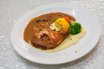 Chicken grill with broccoli, corn, carrot, mashed potato and mushroom sauce