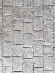 The surface of the concrete that is made into a rectangle shape.