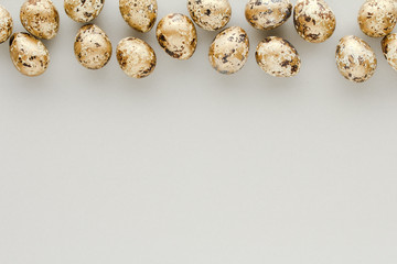Top view easter composition. Golden eggs creative flat lay background with copy space for your text.