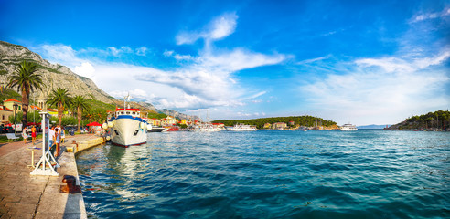 Famous Adriatic resort Makarska with picturesque harbor and touristic boats