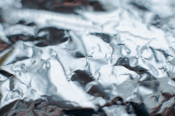 metal foil texture. silver color background, glamorous concept