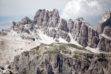 Hike the mountains of Passo Giau. The world famous Dolomites peaks in South Tyrol in the Alps of Italy. Belluno in Europe mountain scenery. Alpine fields